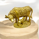 A divine Kamdhenu Cow with Her Child Brass Murti, perfect for worship and pooja, symbolizing prosperity, abundance, and blessings.