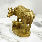 A divine Kamdhenu Cow with Her Child Brass Murti, perfect for worship and pooja, symbolizing prosperity, abundance, and blessings.