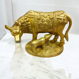 A divine Kamdhenu Cow with Her Child Brass Murti, perfect for worship and pooja, symbolizing prosperity, abundance, and blessings.