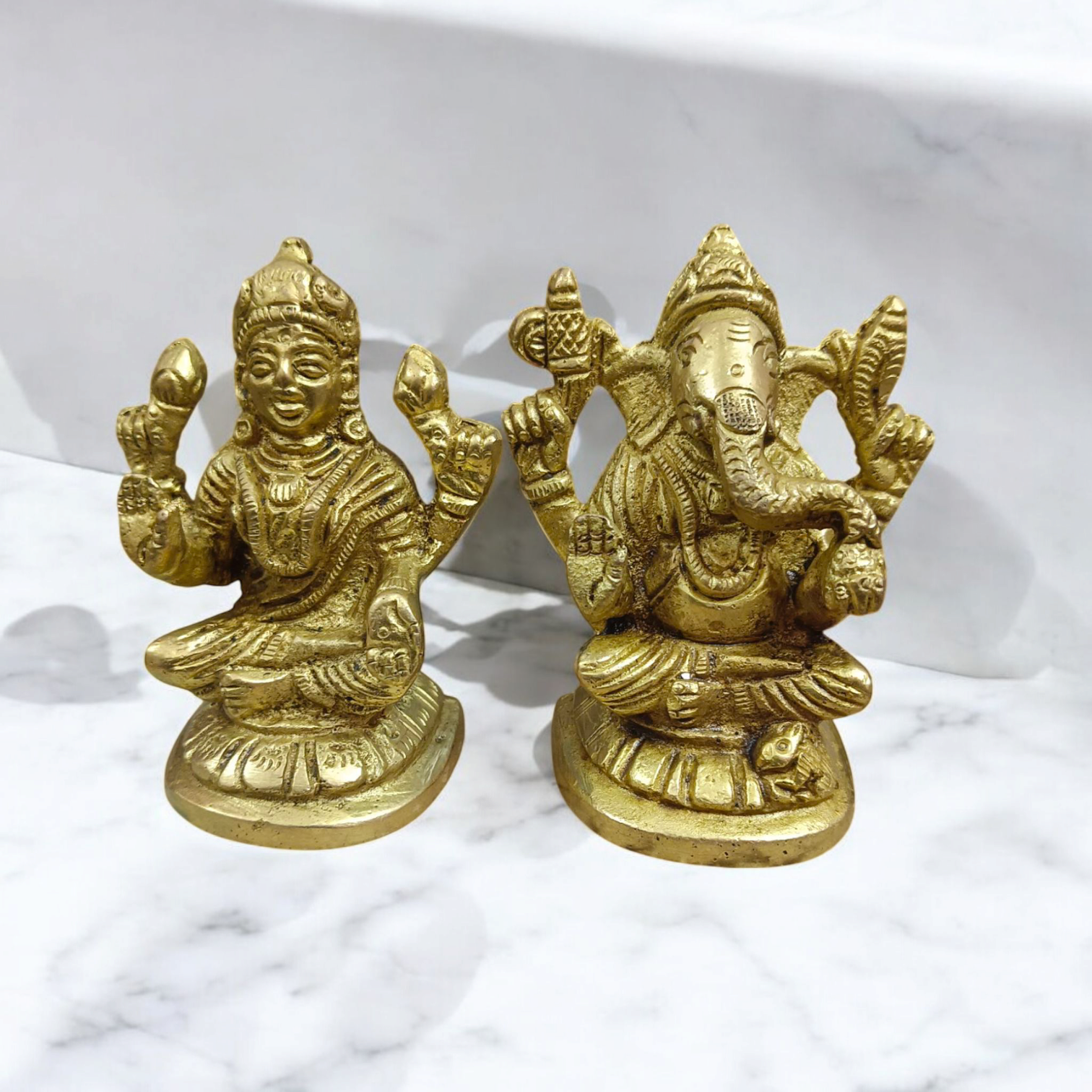 A divine brass murti combining Goddess Lakshmi and Lord Ganesha, designed with intricate details and a gold finish, symbolizing wealth and success.