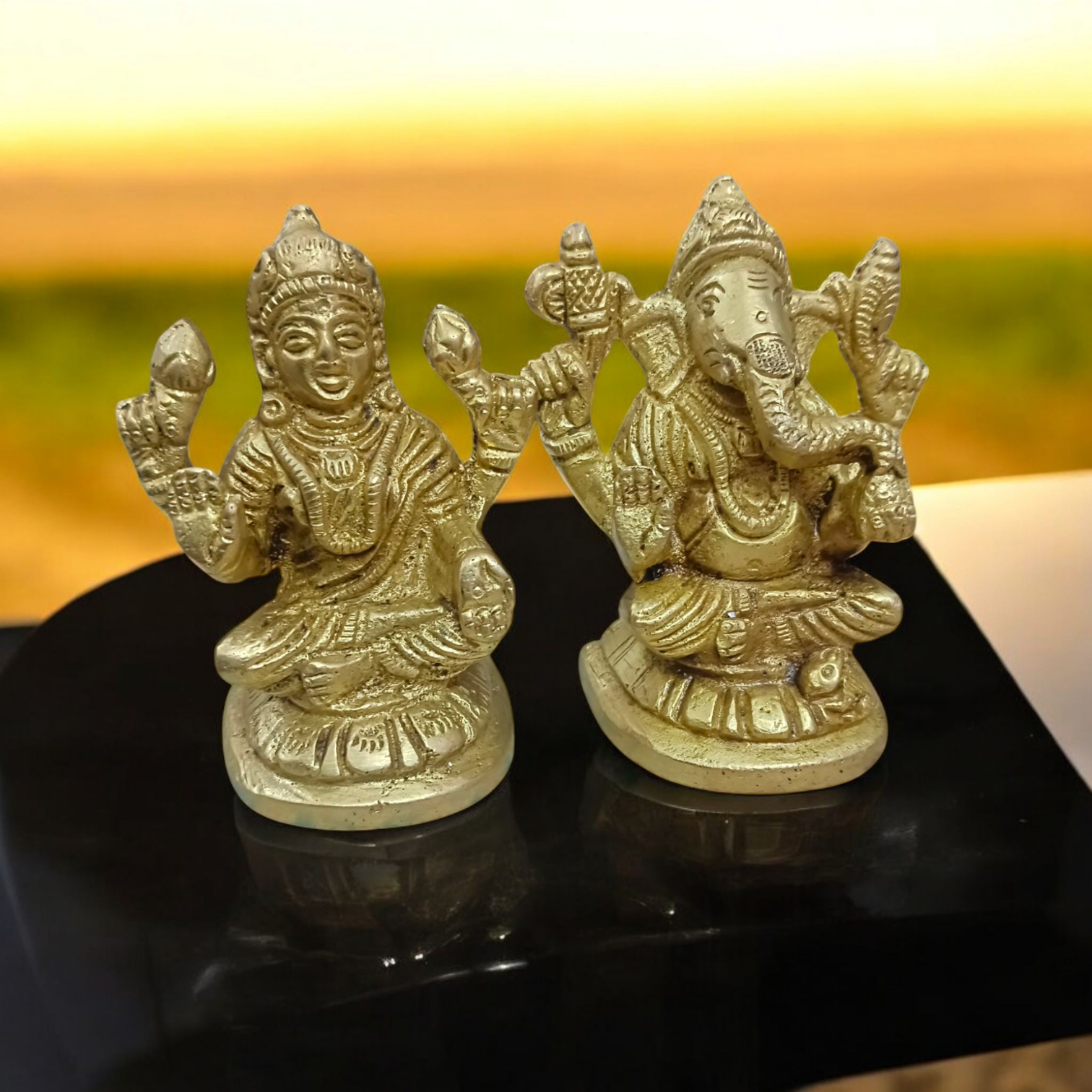 A divine brass murti combining Goddess Lakshmi and Lord Ganesha, designed with intricate details and a gold finish, symbolizing wealth and success.