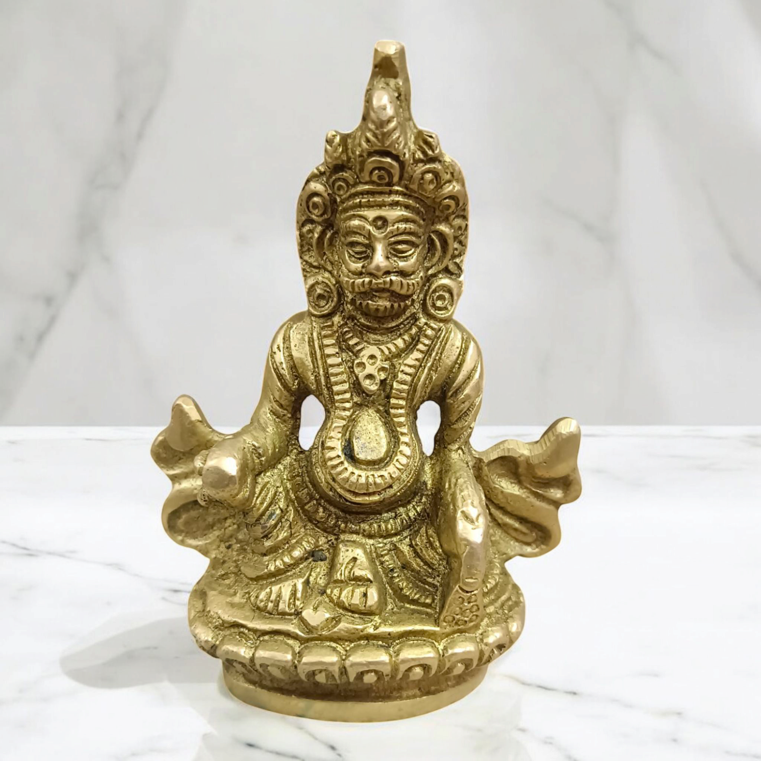 A finely crafted brass statue of Lord Kuber, the god of wealth and prosperity, symbolizing abundance and financial success.