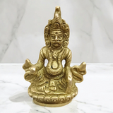 A finely crafted brass statue of Lord Kuber, the god of wealth and prosperity, symbolizing abundance and financial success.
