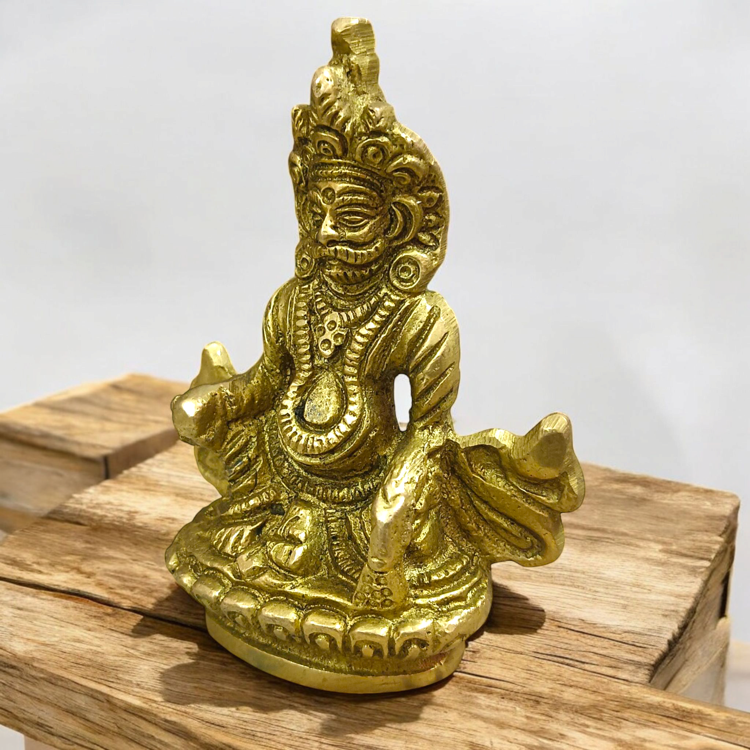 A finely crafted brass statue of Lord Kuber, the god of wealth and prosperity, symbolizing abundance and financial success.