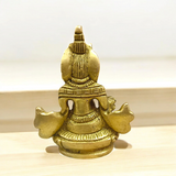 A finely crafted brass statue of Lord Kuber, the god of wealth and prosperity, symbolizing abundance and financial success.