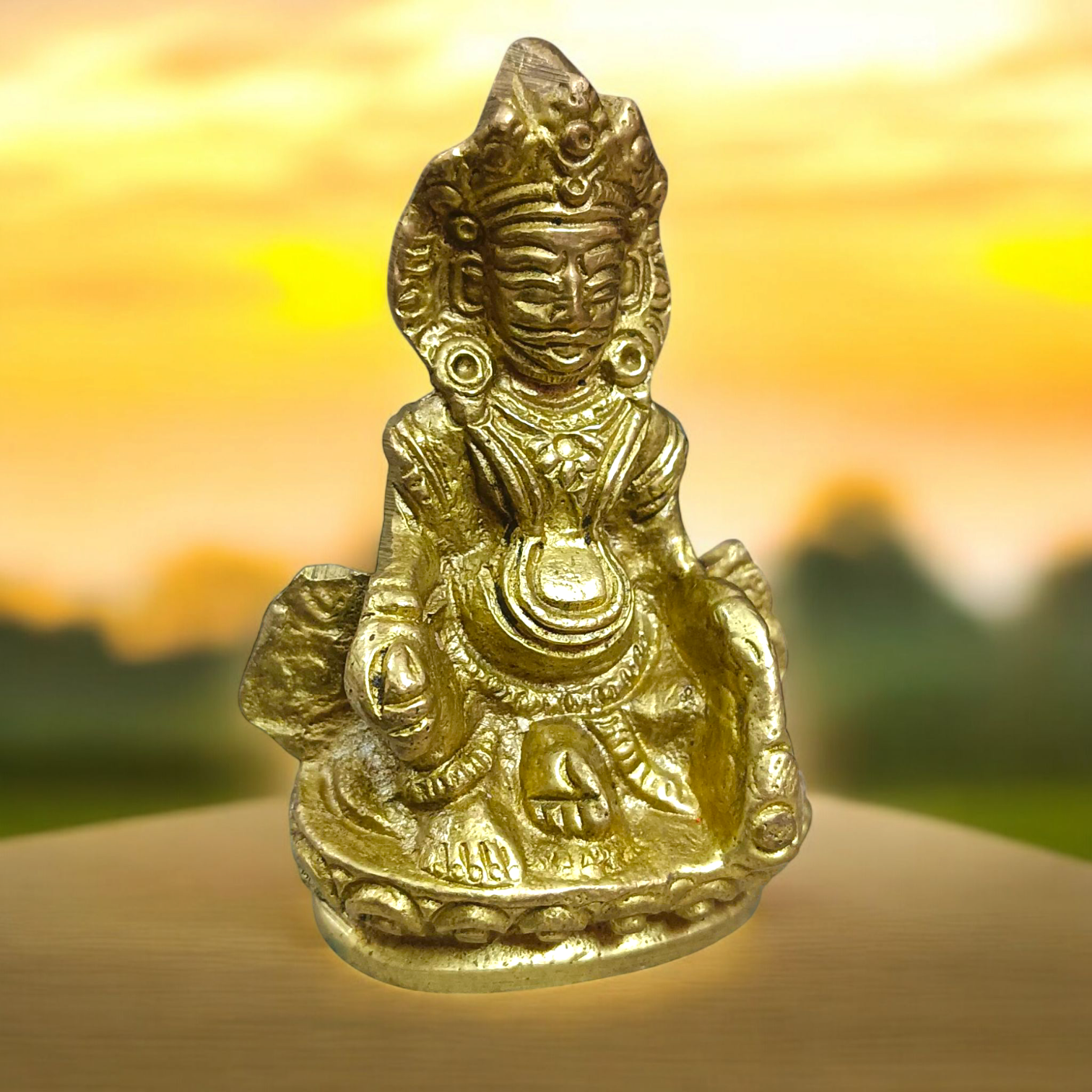 A finely crafted brass statue of Lord Kuber, the god of wealth and prosperity, symbolizing abundance and financial success.