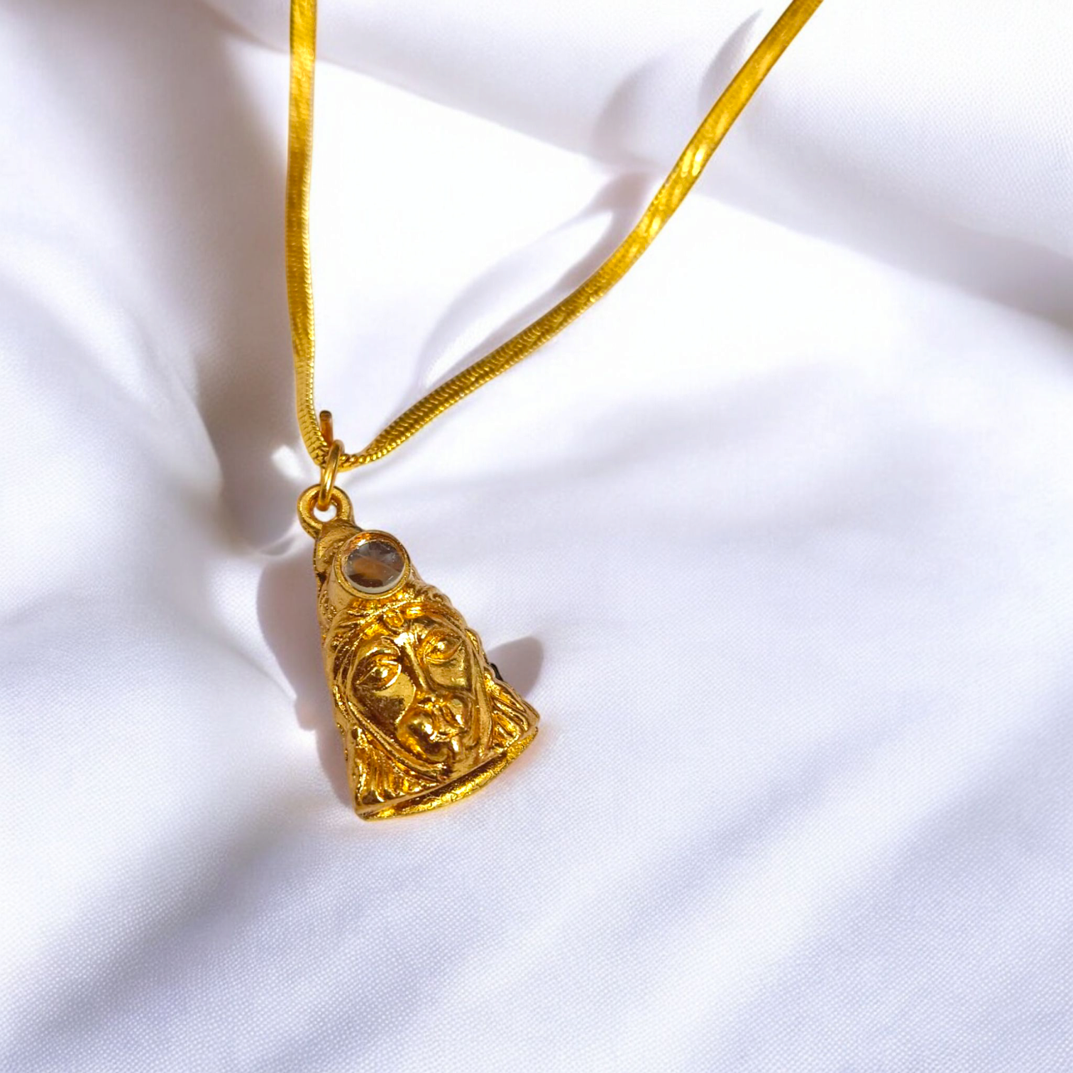 A gold-plated Hanuman Chalisa locket with intricate laser etching and a matching chain, symbolizing spiritual protection and devotion