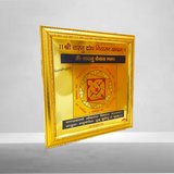 A gold-plated Shri Vaastu Dosh Nivaran Yantra framed beautifully, designed to remove Vastu defects and bring peace, prosperity, and harmony to your space