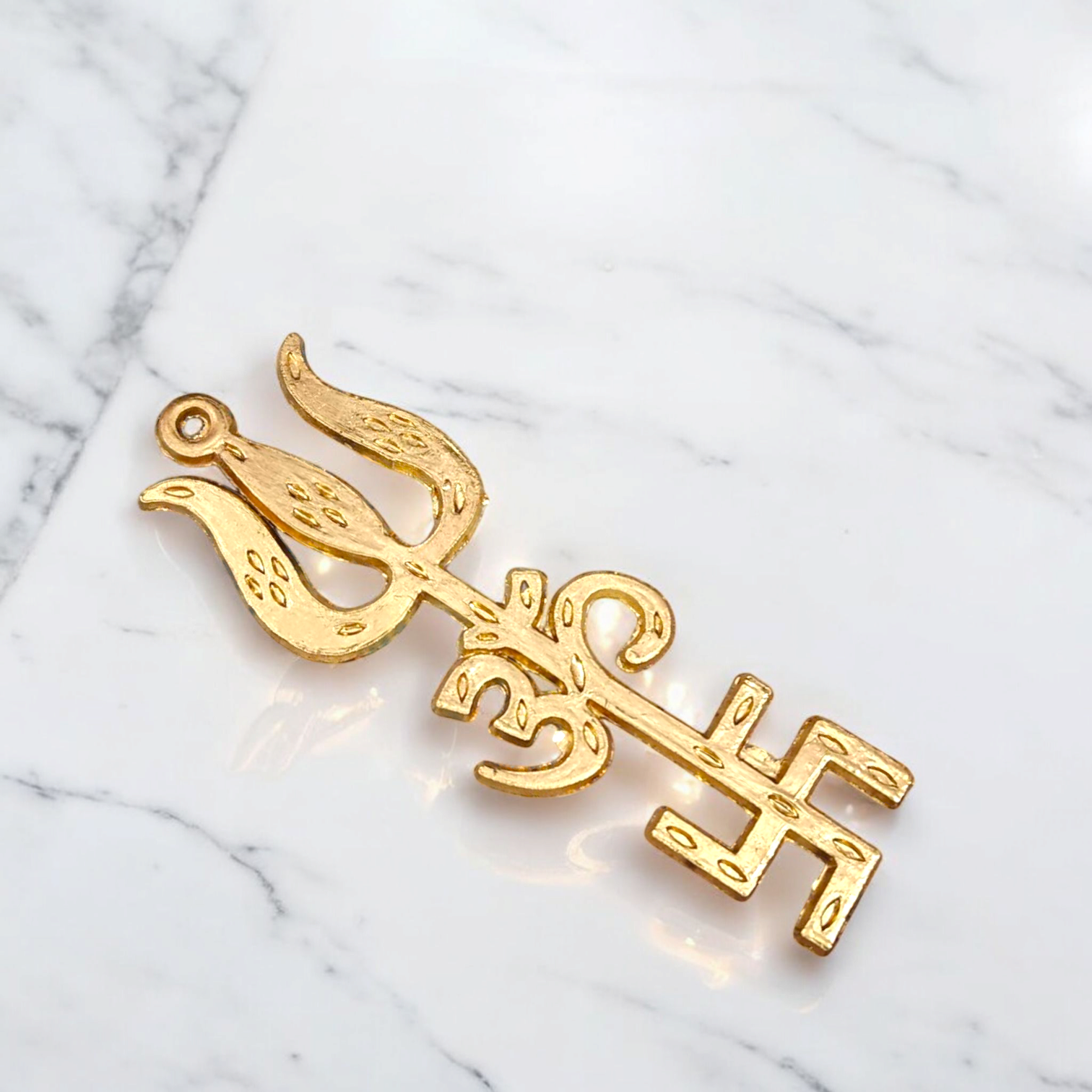 A gold-plated Trishakti wall hanging, designed to invoke protection, prosperity, and spiritual growth in your home or office