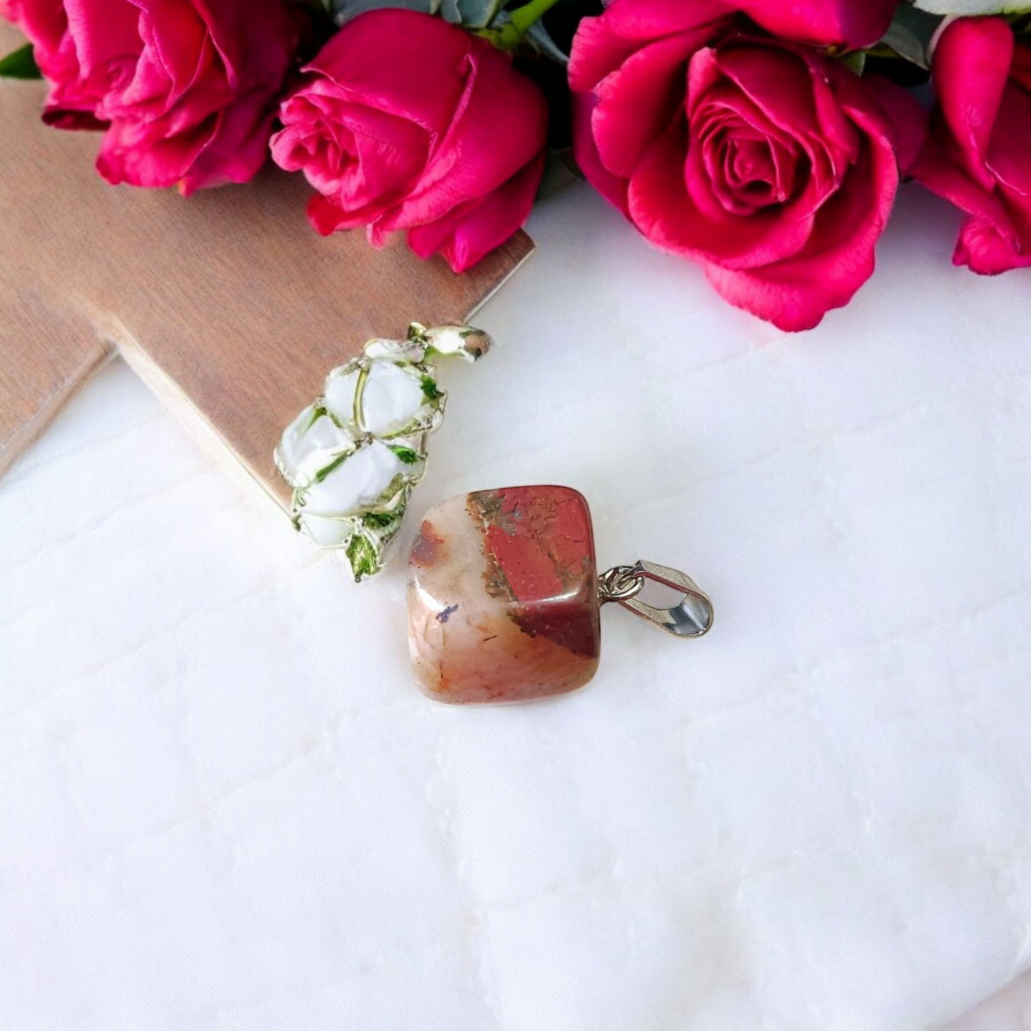 A handcrafted Rainbow Red Jasper Pendant made from natural tumbled gemstone, perfect for healing, emotional stability, and protection