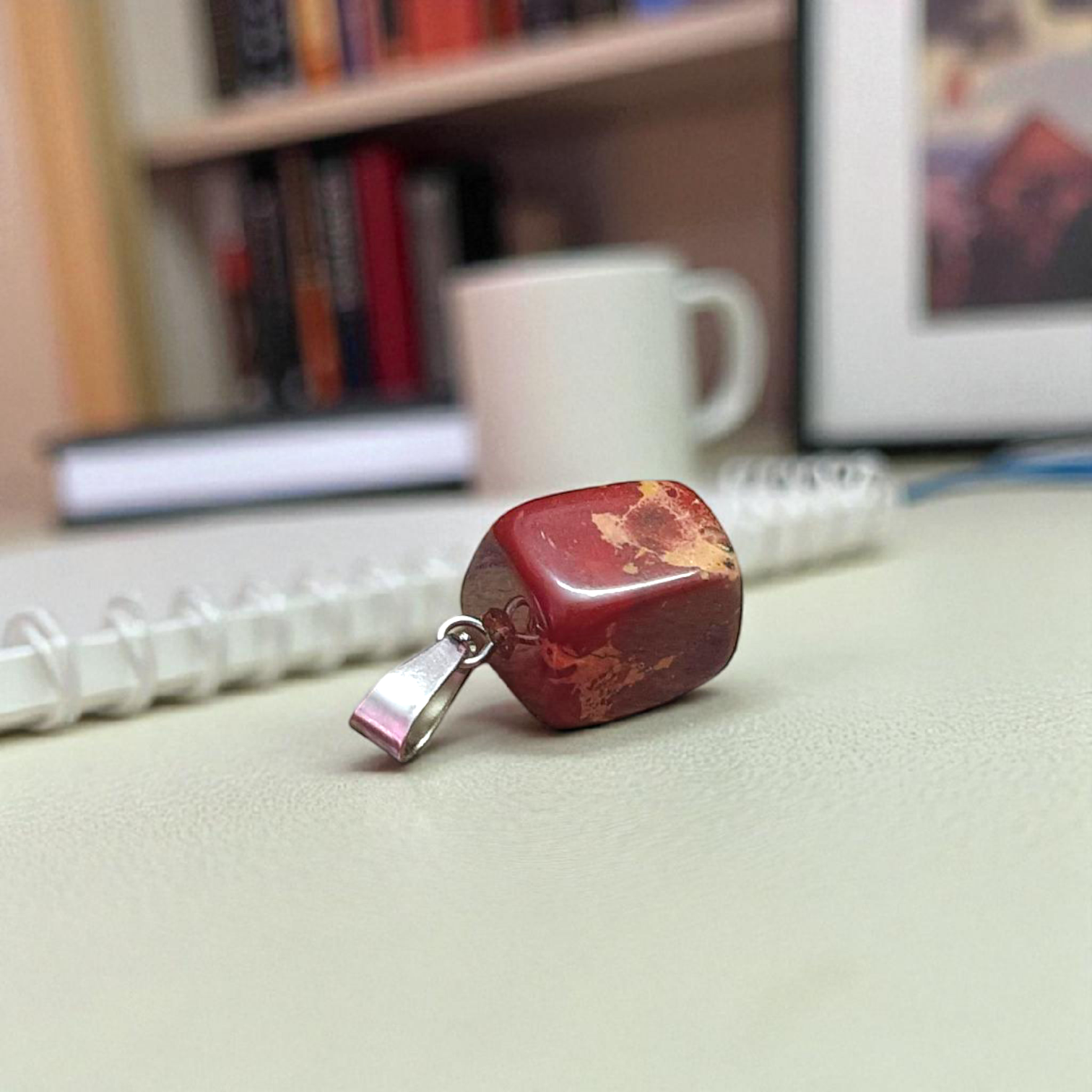 A handcrafted Rainbow Red Jasper Pendant made from natural tumbled gemstone, perfect for healing, emotional stability, and protection