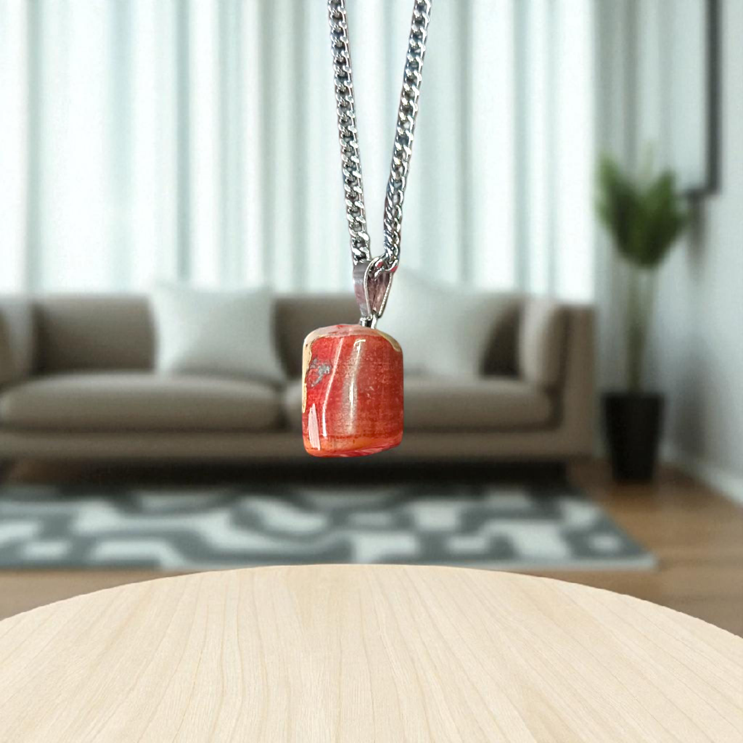 A handcrafted Rainbow Red Jasper Pendant made from natural tumbled gemstone, perfect for healing, emotional stability, and protection