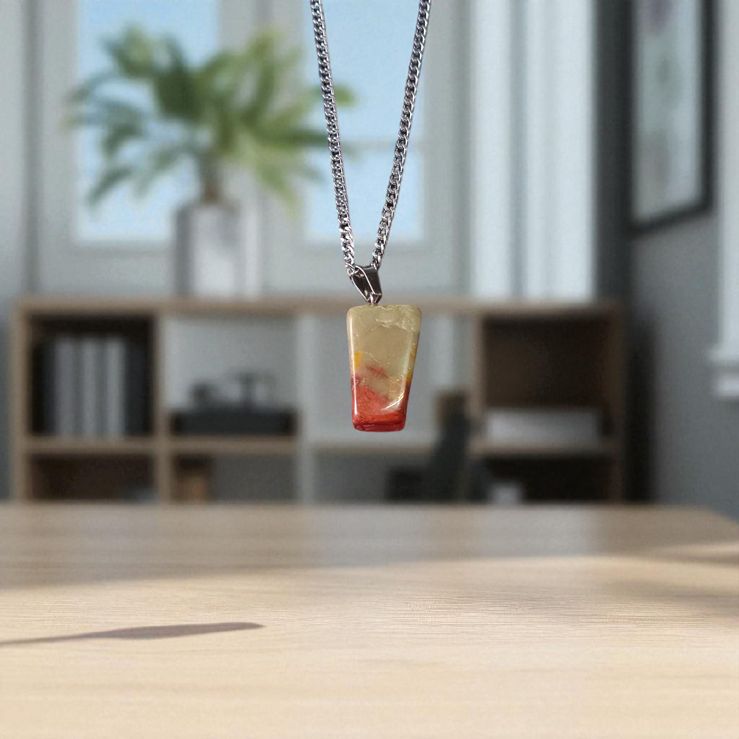 A handcrafted Rainbow Red Jasper Pendant made from natural tumbled gemstone, perfect for healing, emotional stability, and protection
