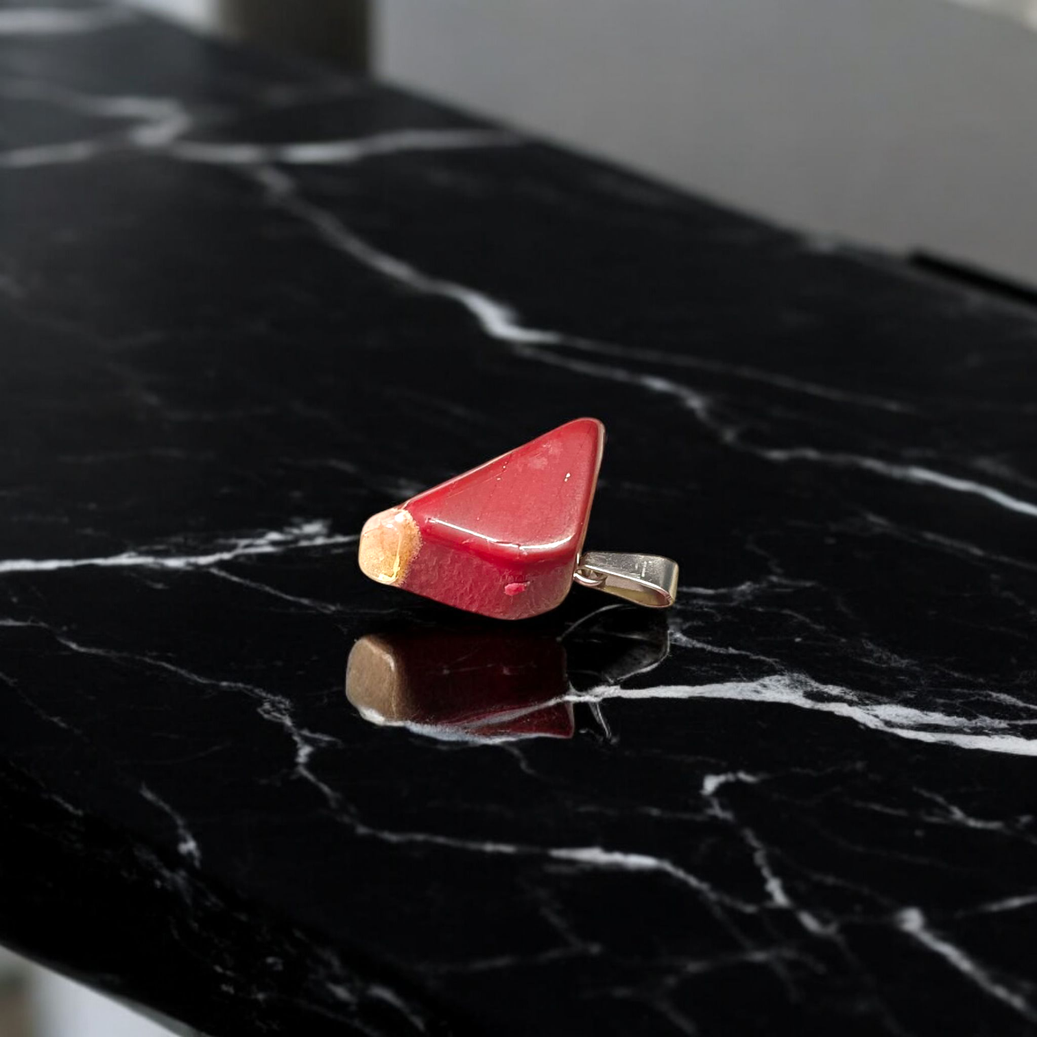 A handcrafted Rainbow Red Jasper Pendant made from natural tumbled gemstone, perfect for healing, emotional stability, and protection