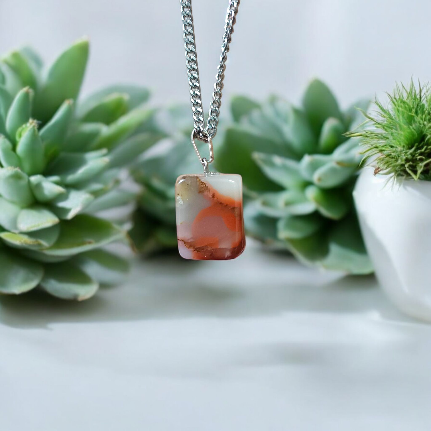 A handcrafted Rainbow Red Jasper Pendant made from natural tumbled gemstone, perfect for healing, emotional stability, and protection