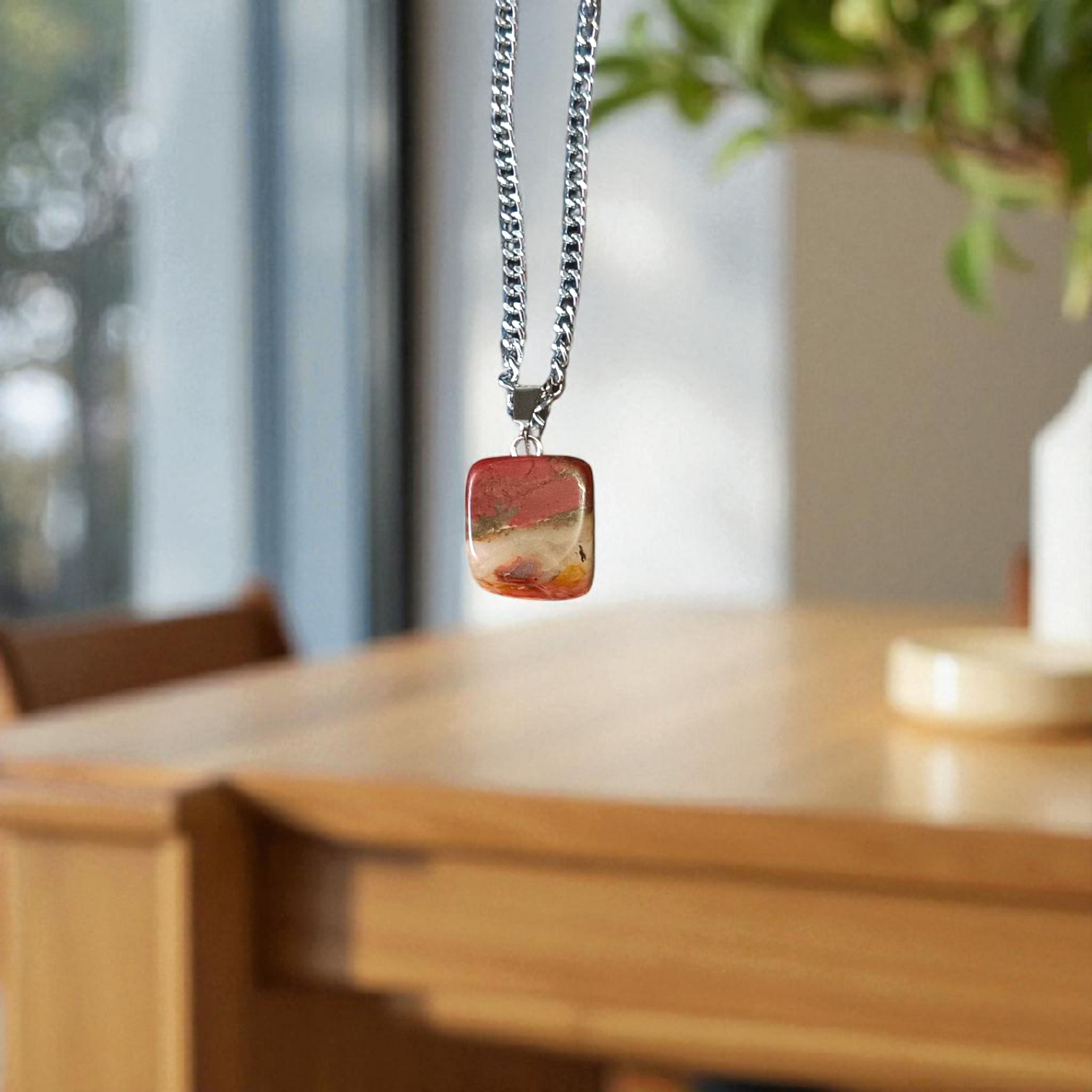 A handcrafted Rainbow Red Jasper Pendant made from natural tumbled gemstone, perfect for healing, emotional stability, and protection