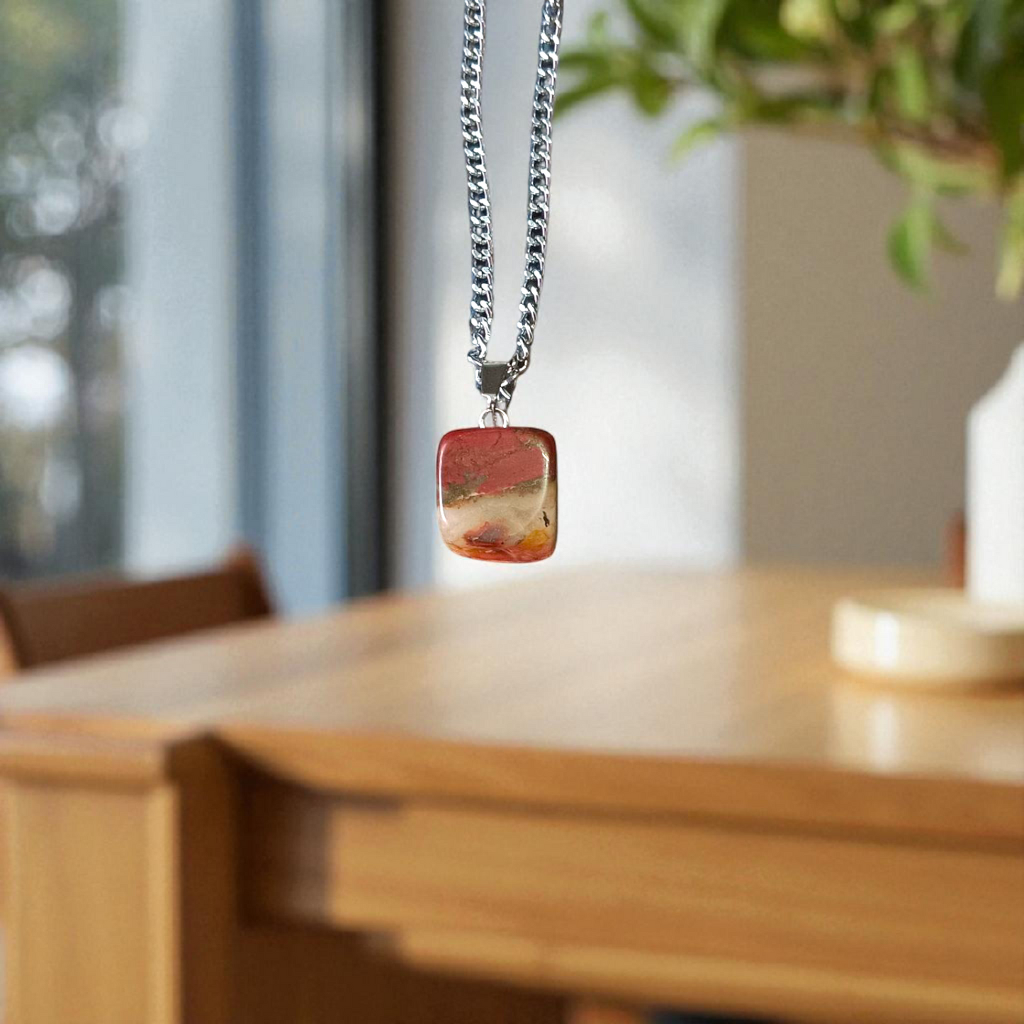 A handcrafted Rainbow Red Jasper Pendant made from natural tumbled gemstone, perfect for healing, emotional stability, and protection