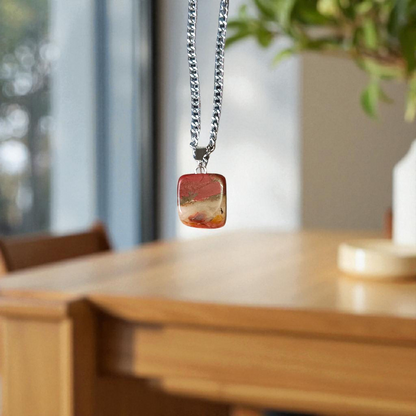 A handcrafted Rainbow Red Jasper Pendant made from natural tumbled gemstone, perfect for healing, emotional stability, and protection