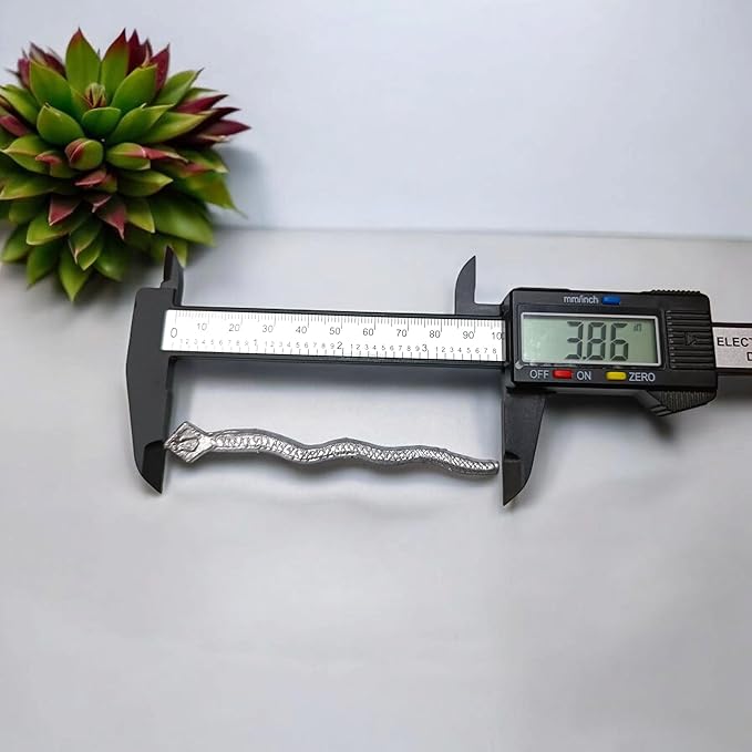 A handcrafted Ranga Naag (Lead Snake) amulet used for Kaal Sarp Dosh remedies, spiritual healing, and protection from negative energies.