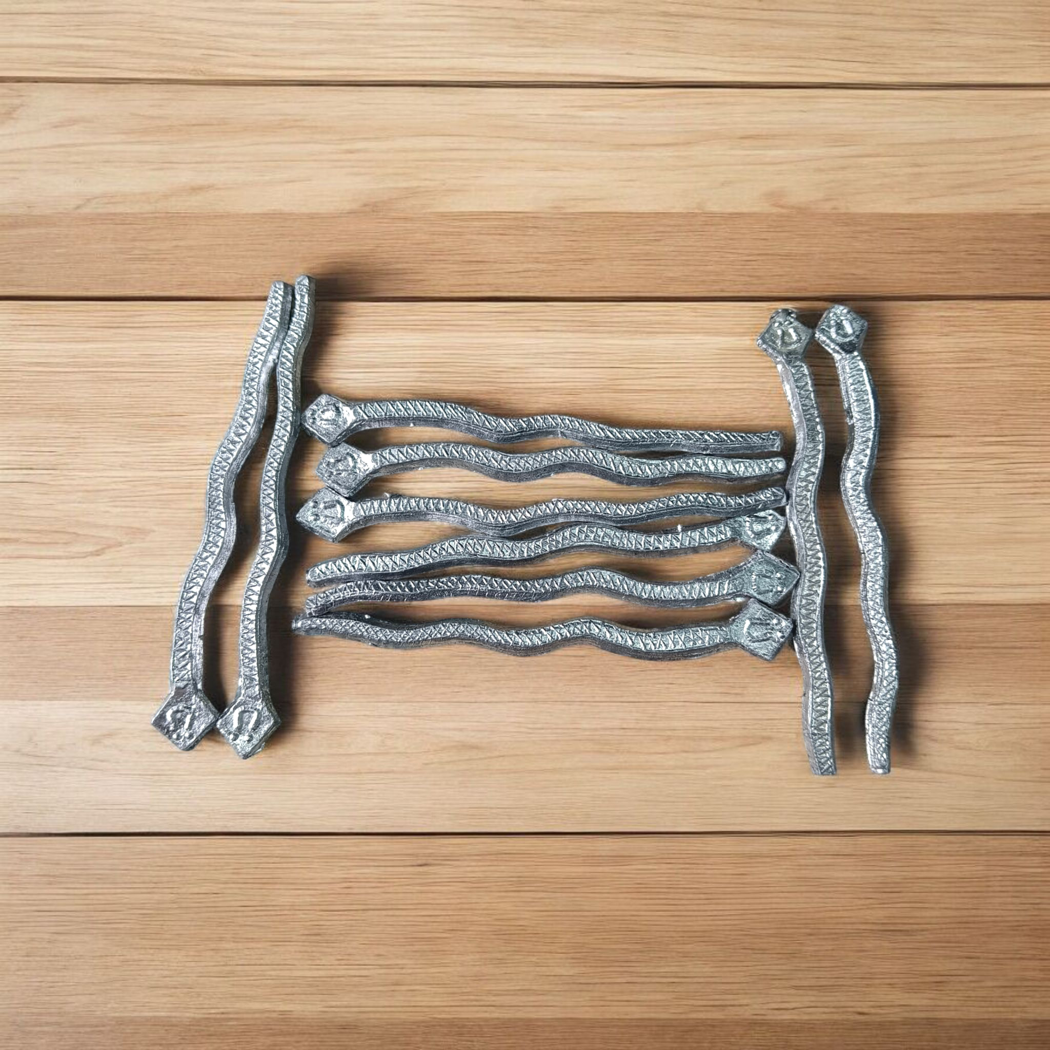 A handcrafted Ranga Naag (Lead Snake) amulet used for Kaal Sarp Dosh remedies, spiritual healing, and protection from negative energies