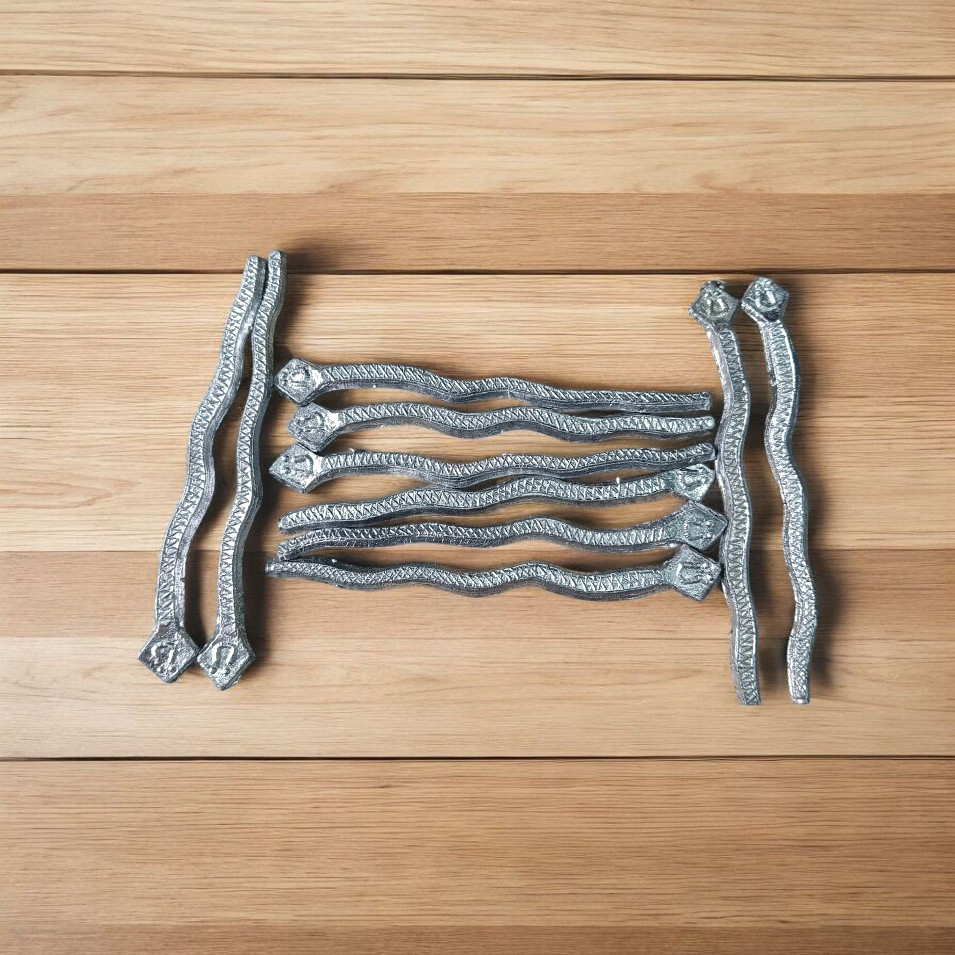 A handcrafted Ranga Naag (Lead Snake) amulet used for Kaal Sarp Dosh remedies, spiritual healing, and protection from negative energies