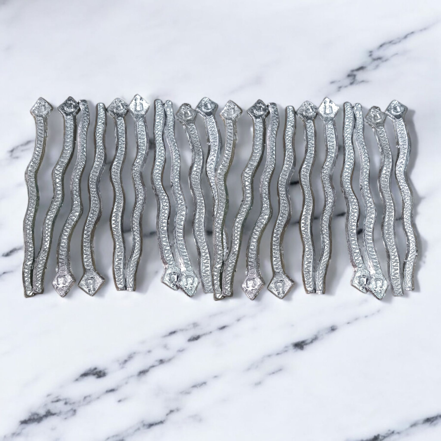 A handcrafted Ranga Naag (Lead Snake) amulet used for Kaal Sarp Dosh remedies, spiritual healing, and protection from negative energies