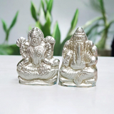 A high-quality image of a Lakshmi Ganesh In Parad Murti, crafted from pure mercury, symbolizing prosperity, wealth, and success, with intricate detailing and lab certification