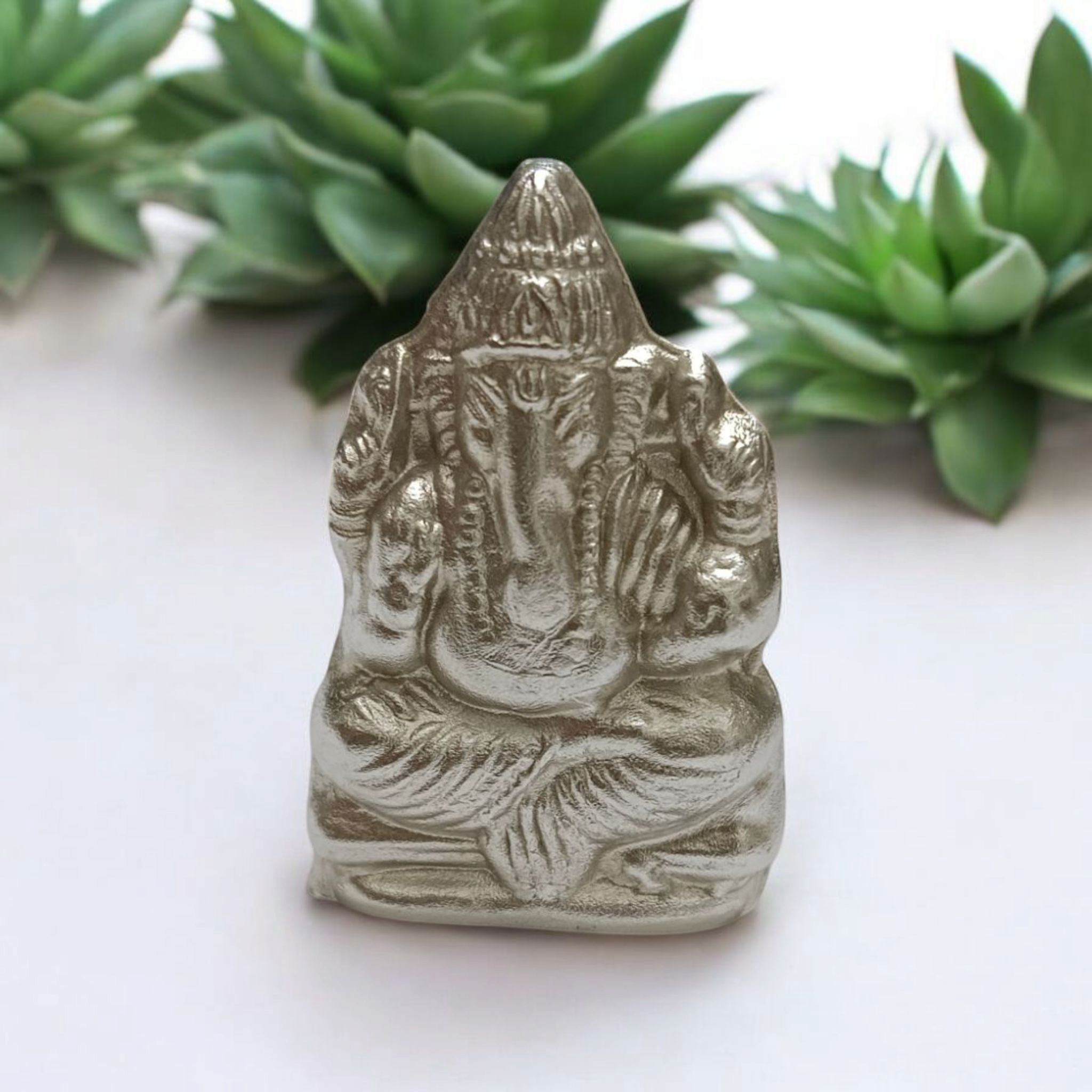 A high-quality image of a Lakshmi Ganesh In Parad Murti, crafted from pure mercury, symbolizing prosperity, wealth, and success, with intricate detailing and lab certification