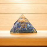 A high-quality image showing the Lapis Lazuli Orgone Pyramid with vibrant blue stones and Orgone resin, emphasizing its spiritual and healing properties