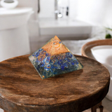 A high-quality image showing the Lapis Lazuli Orgone Pyramid with vibrant blue stones and Orgone resin, emphasizing its spiritual and healing properties