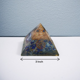 A high-quality image showing the Lapis Lazuli Orgone Pyramid with vibrant blue stones and Orgone resin, emphasizing its spiritual and healing properties