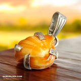 A lab-certified natural Machh Mani gemstone set in a pure silver pendant, offering spiritual and astrological benefits.
