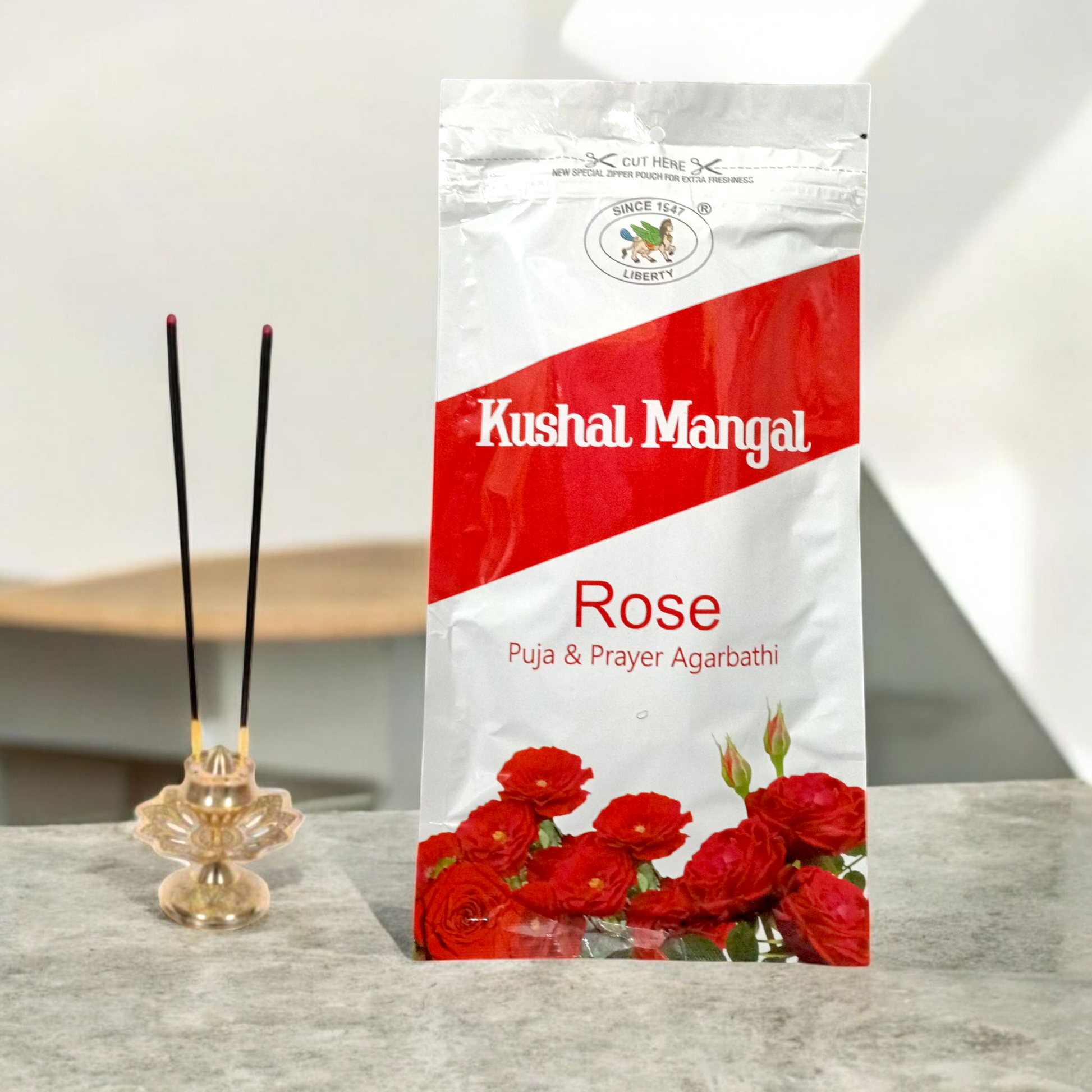 A pack of Kushal Mangal Rose Incense Sticks with a calming rose fragrance, perfect for meditation, relaxation, and creating a peaceful atmosphere.