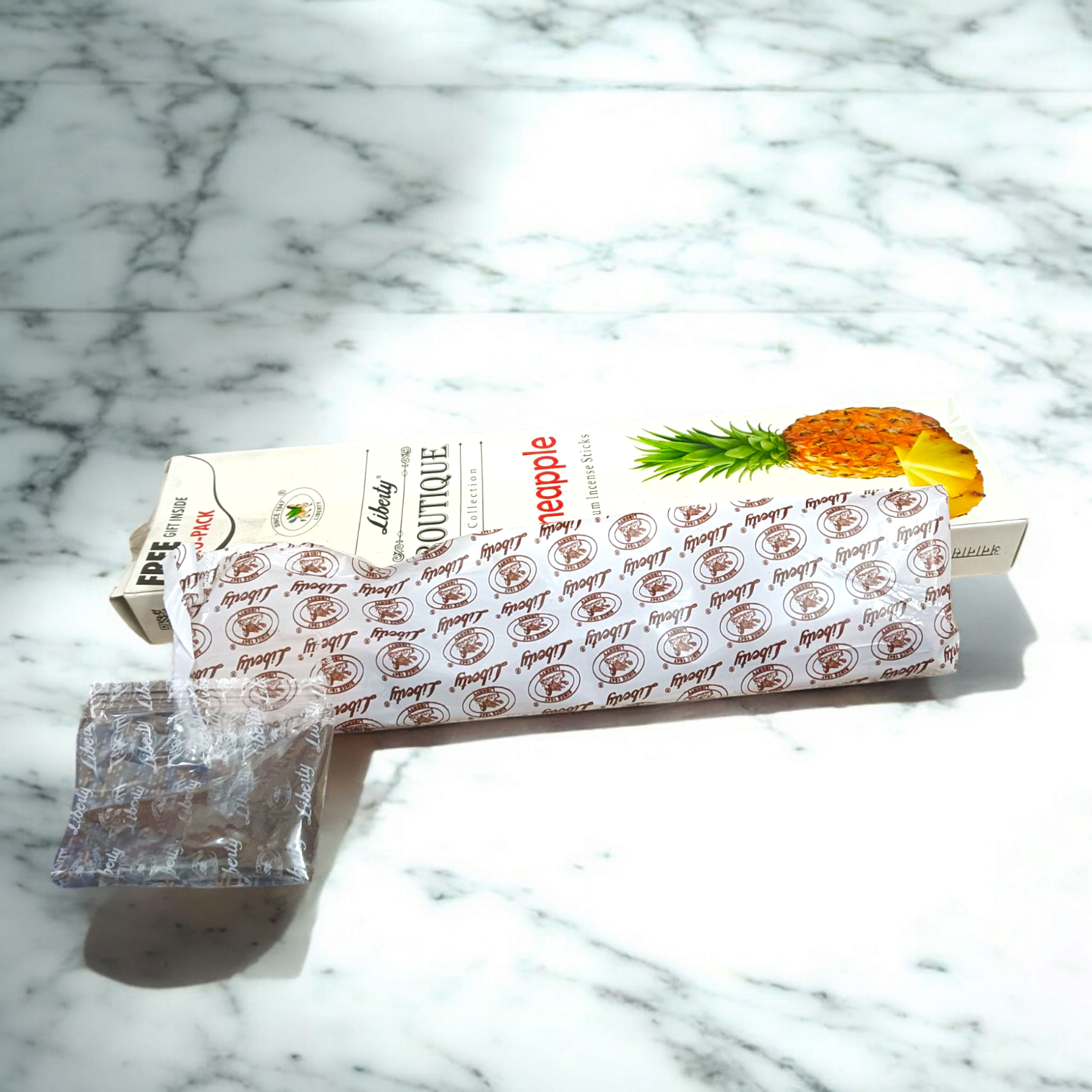 A pack of pineapple incense sticks in an economy pack, with a free gift included inside. The sweet, tropical scent enhances relaxation and purifies the air.