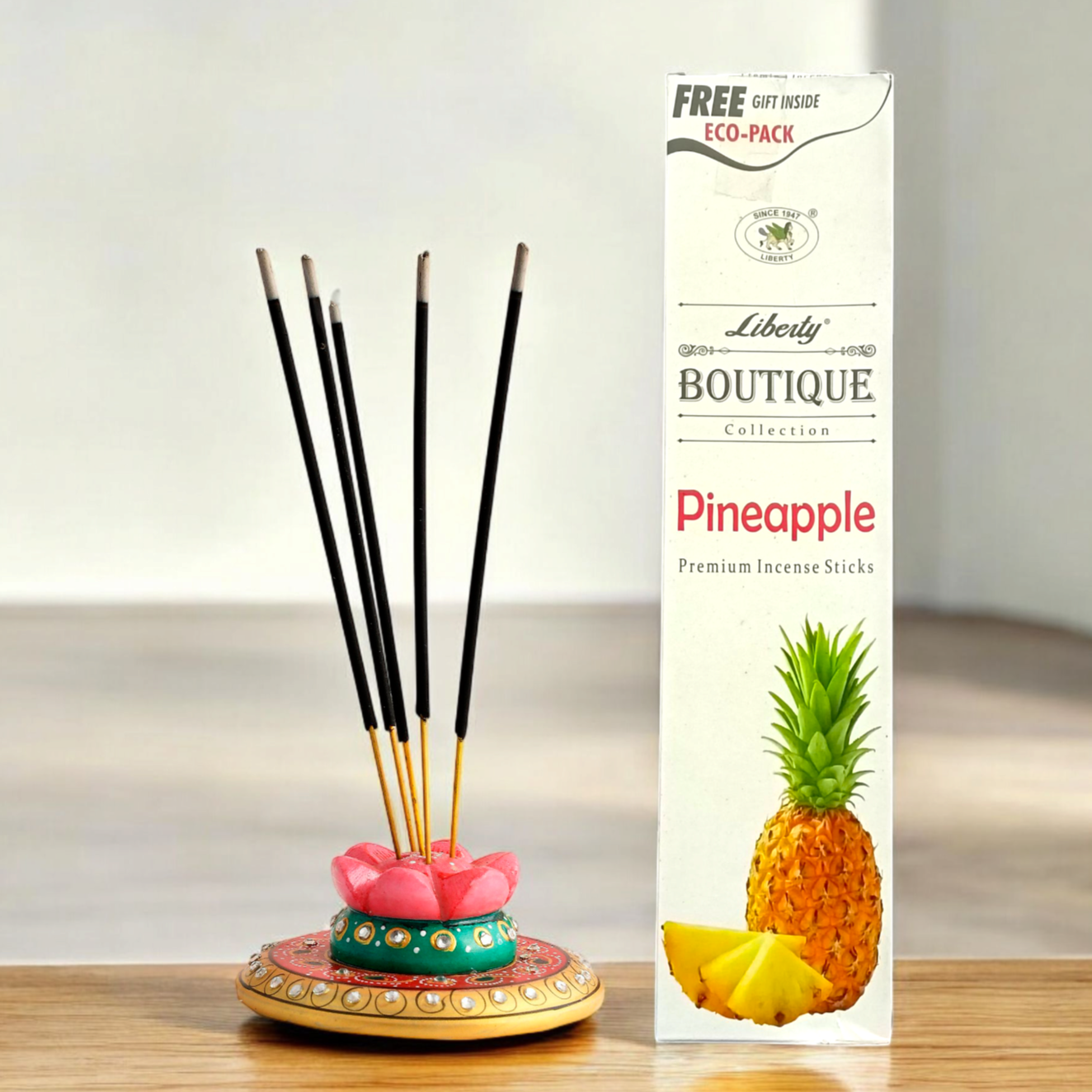 A pack of pineapple incense sticks in an economy pack, with a free gift included inside. The sweet, tropical scent enhances relaxation and purifies the air.