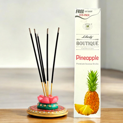 A pack of pineapple incense sticks in an economy pack, with a free gift included inside. The sweet, tropical scent enhances relaxation and purifies the air.