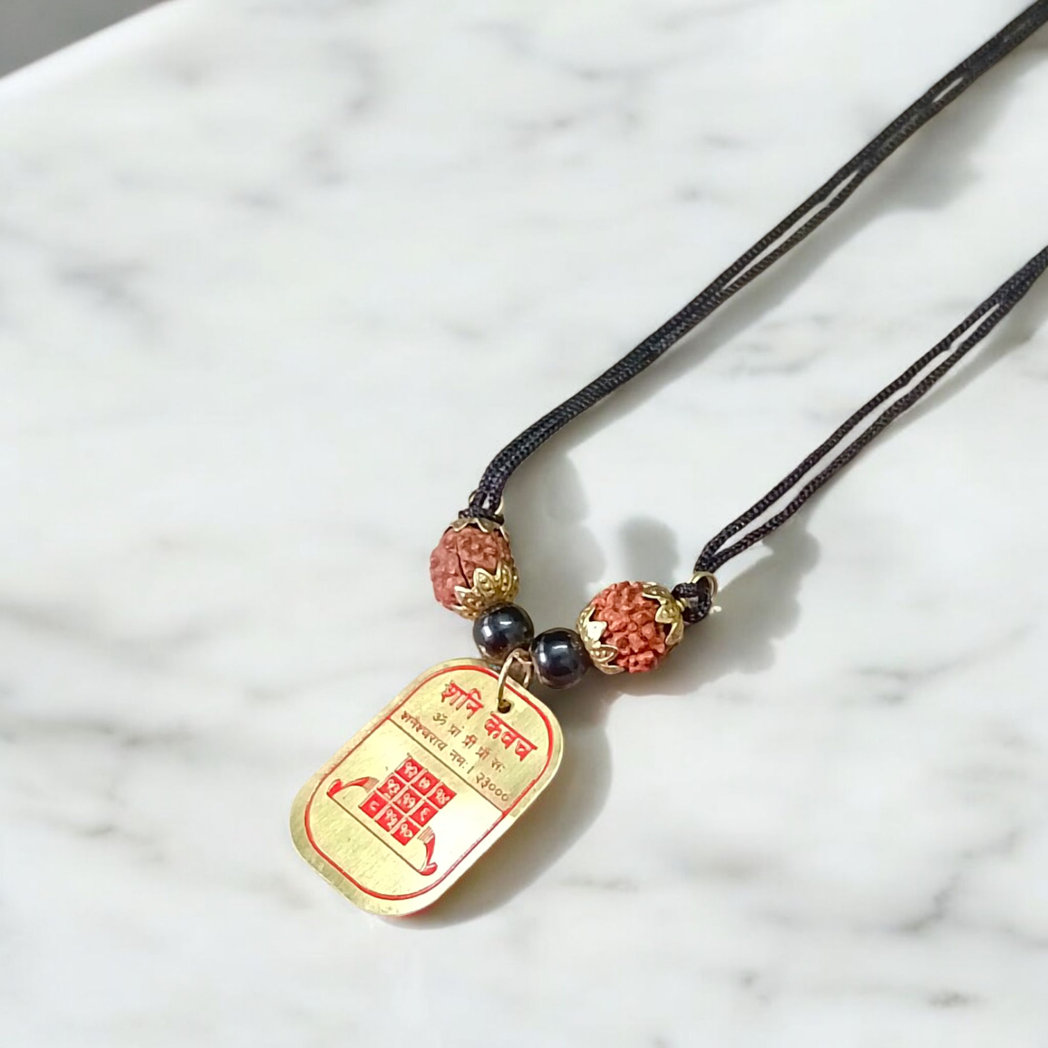 A powerful and lab-certified Divya Shani Dosh Nivaran Kawach, energized for protection against Saturn’s negative effects and designed to bring peace, prosperity, and balance