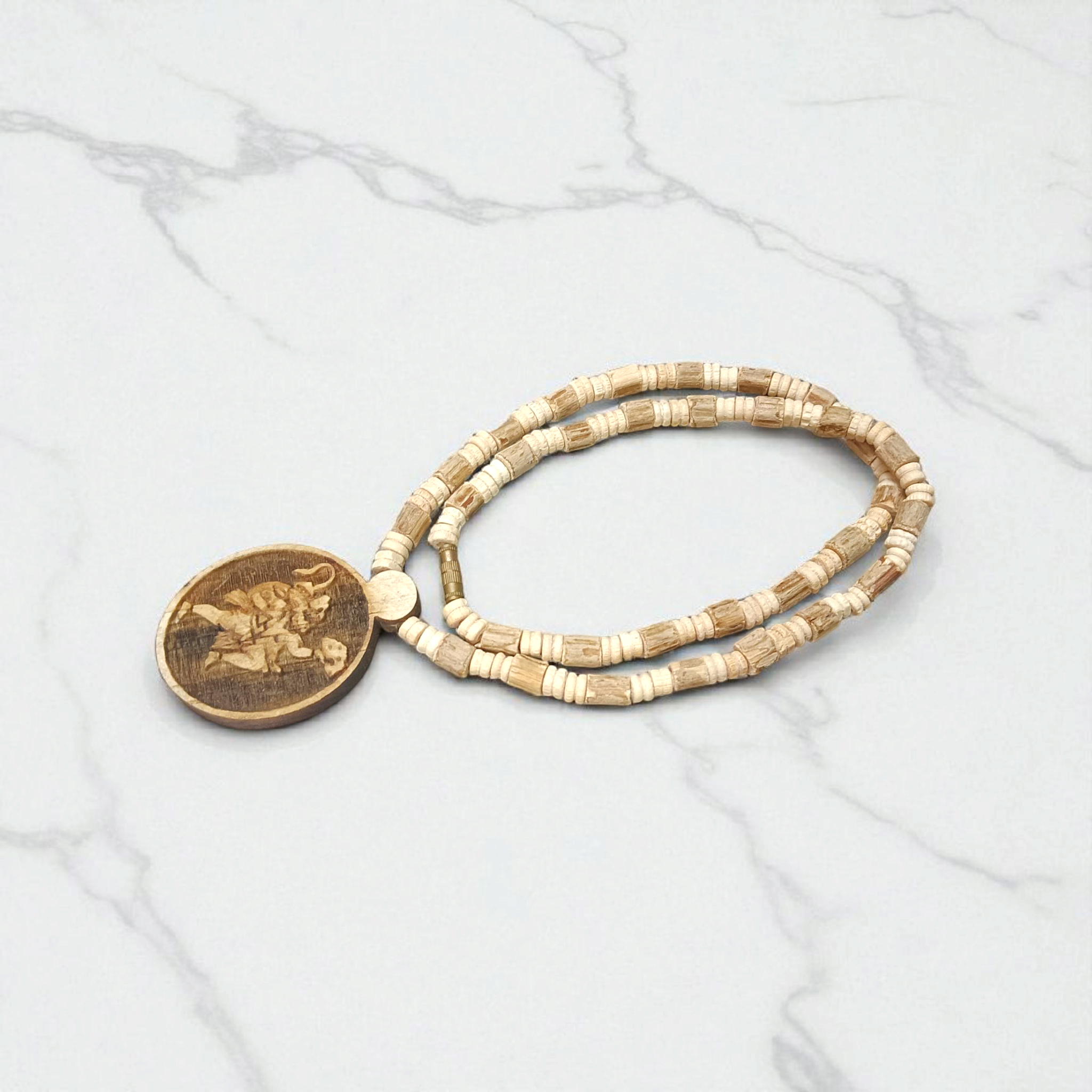 A sacred Hanuman Ji Locket embedded in a traditional Tulsi Mala, symbolizing strength, protection, and devotion to Lord Hanuman