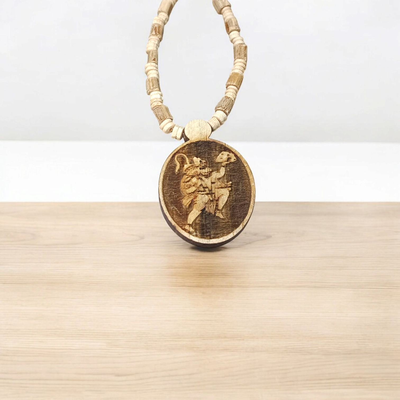 A sacred Hanuman Ji Locket embedded in a traditional Tulsi Mala, symbolizing strength, protection, and devotion to Lord Hanuman