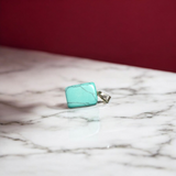 A set of Hit Turquoise Blue Howlite tumbled stones, featuring a mix of turquoise and white veins