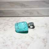 A set of Hit Turquoise Blue Howlite tumbled stones, featuring a mix of turquoise and white veins