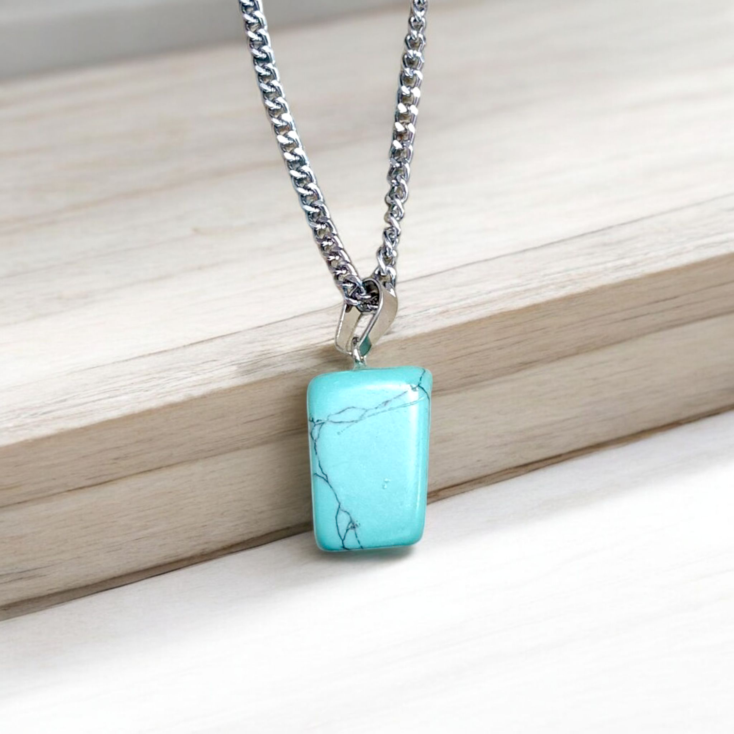 A set of Hit Turquoise Blue Howlite tumbled stones, featuring a mix of turquoise and white veins