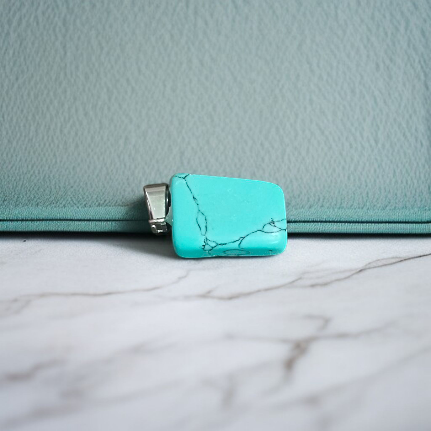 A set of Hit Turquoise Blue Howlite tumbled stones, featuring a mix of turquoise and white veins