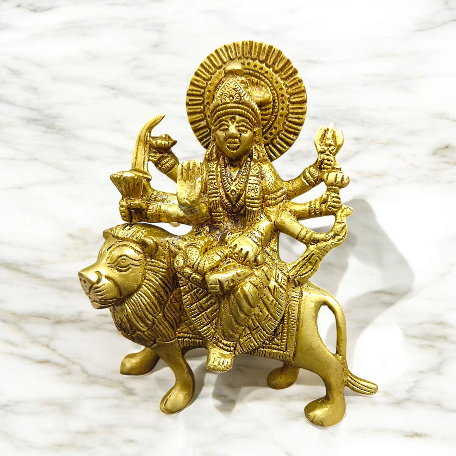 A set of three beautifully handcrafted brass idols representing Maa Durga, Sherwali Mata, and Maa Vaishno Devi, each symbolizing divine power and blessings.