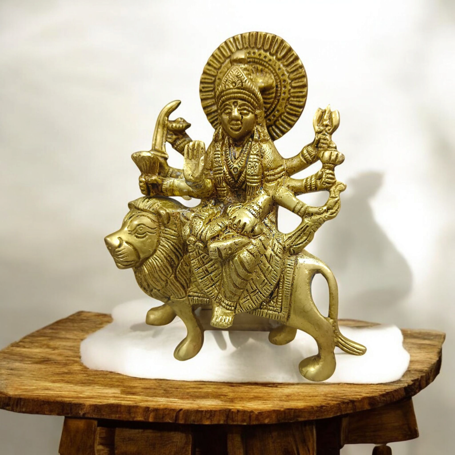 A set of three beautifully handcrafted brass idols representing Maa Durga, Sherwali Mata, and Maa Vaishno Devi, each symbolizing divine power and blessings.