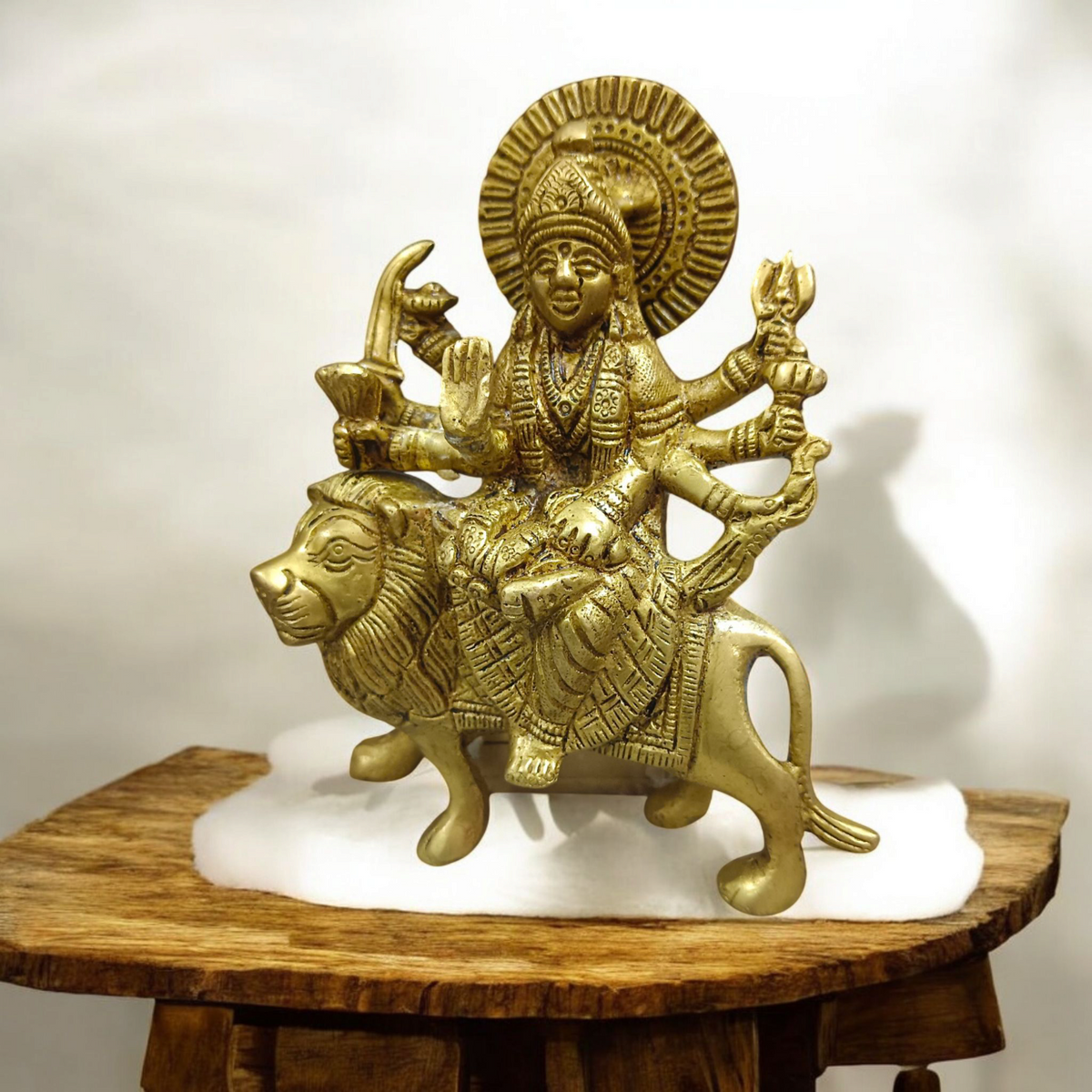 A set of three beautifully handcrafted brass idols representing Maa Durga, Sherwali Mata, and Maa Vaishno Devi, each symbolizing divine power and blessings.