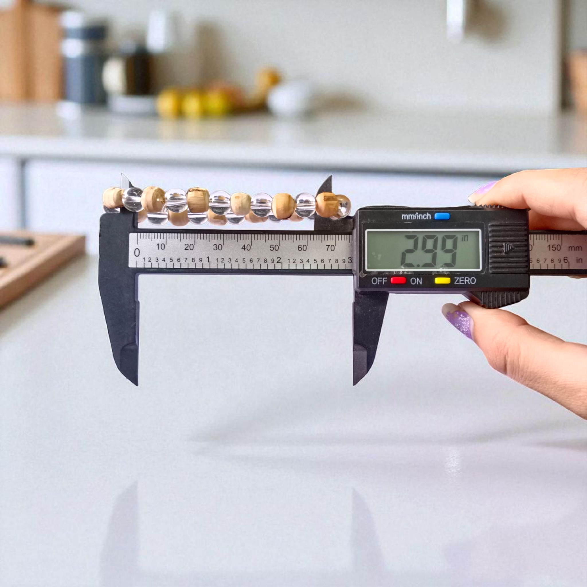 A stretchable 8mm beaded bracelet made from natural Tulsi and Sphatik crystals, ideal for spiritual and healing use, placed against a white background