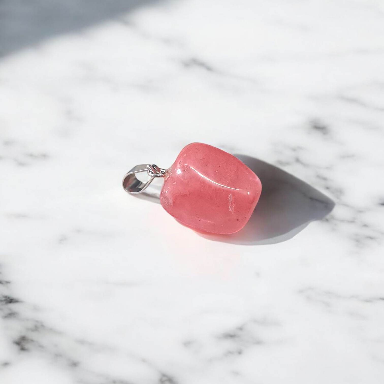 A stunning Rose Quartz Tumble Stone Pendant, lab-certified for authenticity, symbolizing love, healing, and positive energy