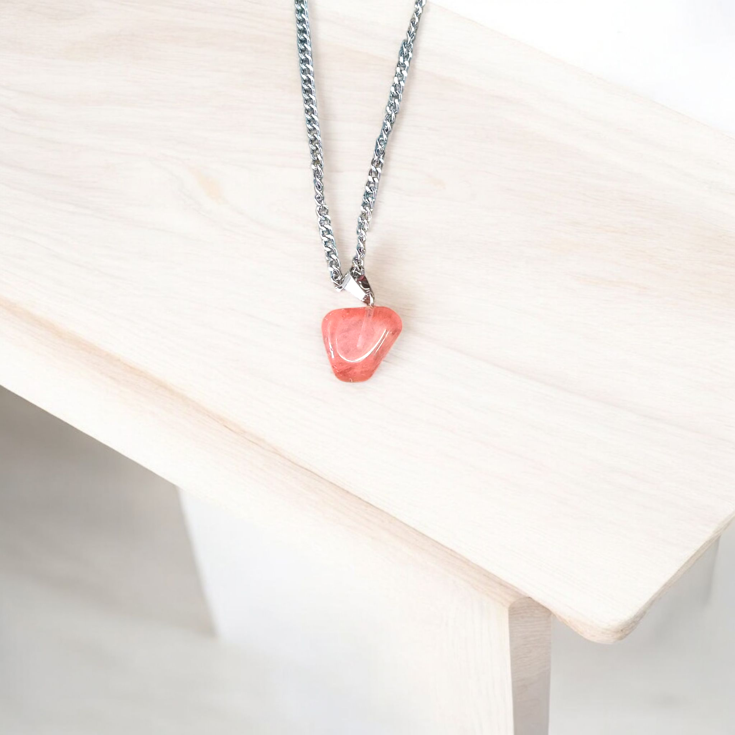 A stunning Rose Quartz Tumble Stone Pendant, lab-certified for authenticity, symbolizing love, healing, and positive energy