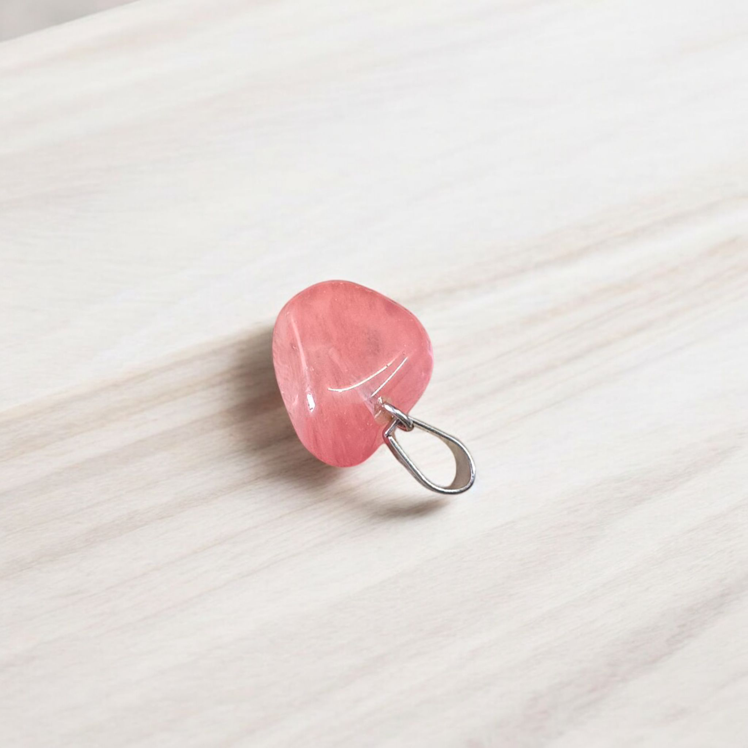 A stunning Rose Quartz Tumble Stone Pendant, lab-certified for authenticity, symbolizing love, healing, and positive energy